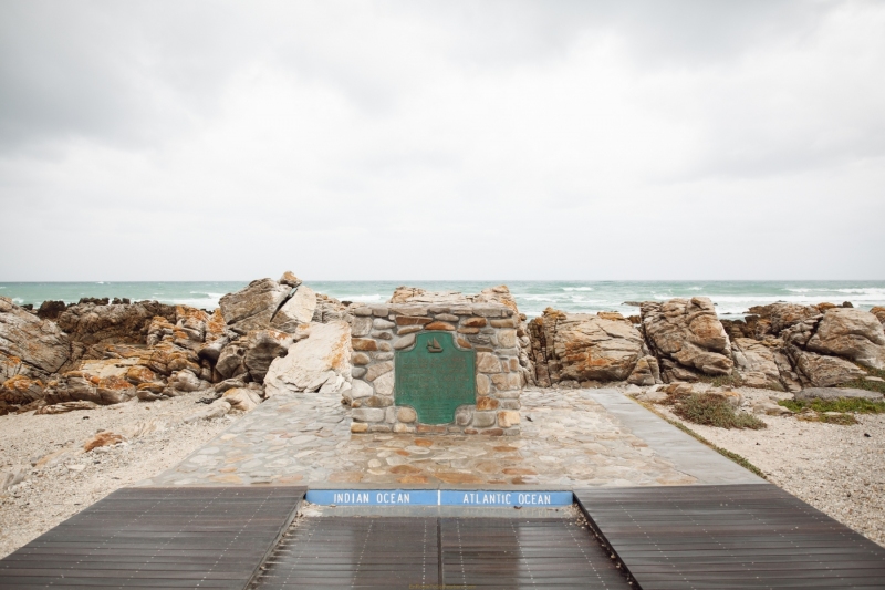 A sign on the walkway shows the line that divides the Indian and Atlantic Oceans